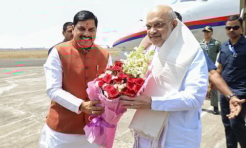 Union Home Minister Amit Shah being welcomed by Madhya Pradesh Chief Minister Mohan Yadav upon his arrival in Bhopal. 
