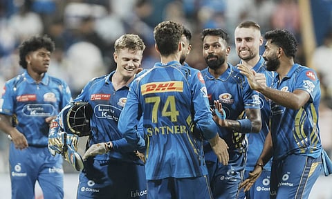  Mumbai Indians players celebrate the dismissal of Sunrisers Hyderabad's Travis Head during the IPL T20 match between Mumbai Indians and Sunrisers Hyderabad at the Wankhede Stadium (PTI)