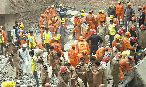 Rescue operation underway after a four-storey building collapsed trapping several people, in Dayalpur area of New Delhi, early Saturday, April 19, 2025 (PTI)