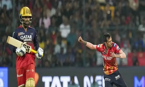 Yuzvendra Chahal celebrates the wicket of Jitesh Sharma (PTI)