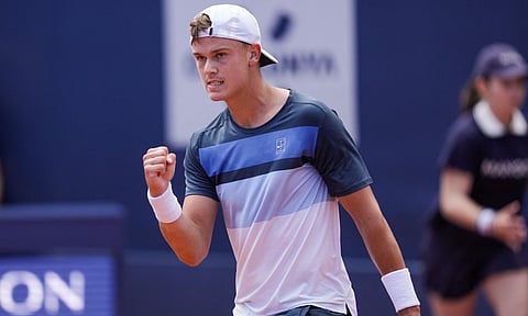 Holger Rune celebrates after winning the match (AP)