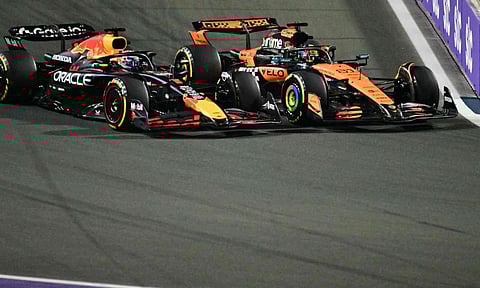  Max Verstappen tries to overtake McLaren's Oscar Piastri during the race 