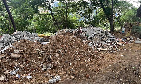 Construction waste dumped along the road opposite the RTO in New Avadi Road in Ayanavaram