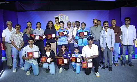 TNSJA award winners at the event with the chief guests onstage 