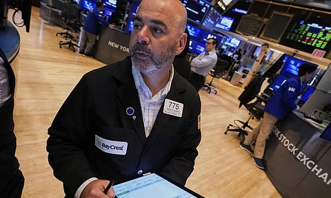 Trader Fred Demarco works on the floor of the New York Stock Exchange (AP)