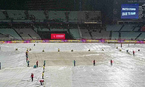 Ground staff covers the field after rain stopped play during an Indian Premier League (IPL) 2025 T20 cricket match between Kolkata Knight Riders and Punjab Kings, at the Eden Gardens stadium (PTI)