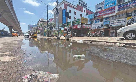 Overflowing sewage on the Koyambedu Market East Road