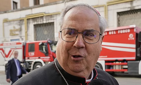 Argentine Cardinal Angel Sixto Rossi speaks to reporters as he arrives for a college of cardinals' meeting, at the Vatican (AP)