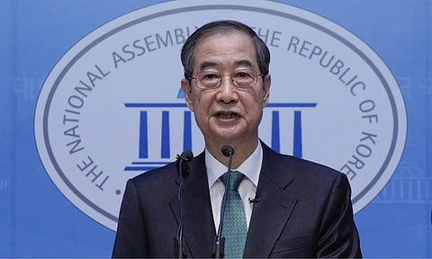 South Korean former PM Han Duck-Soo speaks during a press conference to announce a presidential bid at the National Assembly in Seoul (AP)