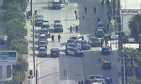 Law enforcement gathers outside Spartan College of Aeronautics and Technology, Inglewood (AP)