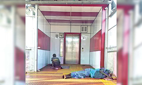 People sleeping near the elevator, which has remained closed over for more than a year