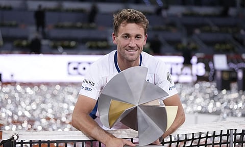 Norway's Casper Rudd holds the trophy after winning the Madrid Open tennis final in Madrid, Spain (AP)