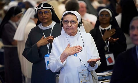 Nuns pray during a congress of nearly 900 superiors of the world's female religious orders in Rome (AP)