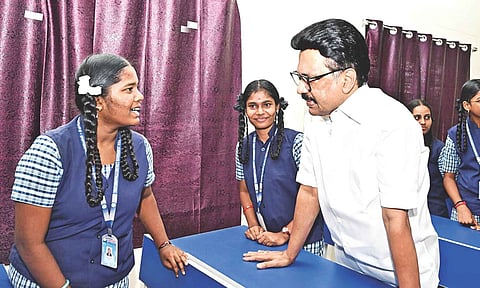 Chief Minister MK Stalin interacting with a student at the model school in Tiruchy on Thursday 