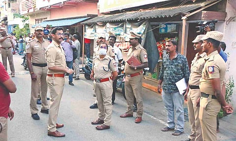 Police inquiring at the murder spot on Sunday