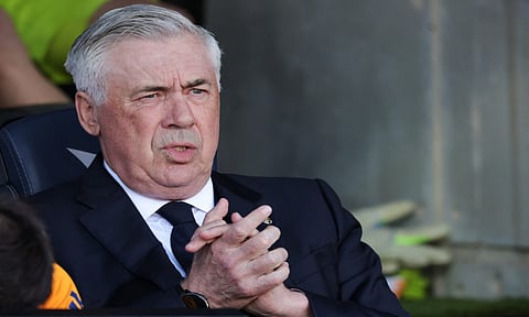Carlo Ancelotti exits after a press conference