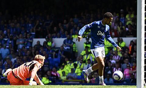 Iliman Ndiaye dribbles past Aaron Ramsdale to score for Everton

