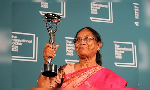 Banu Mushtaq, author of 'Heart Lamp' holds the trophy after winning the International Booker Prize, in London (AP) 