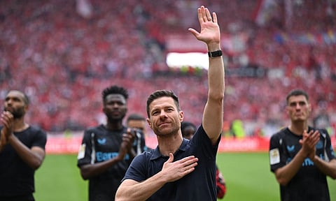 Xabi Alonso gestures to crowd after Leverkusen's final home game