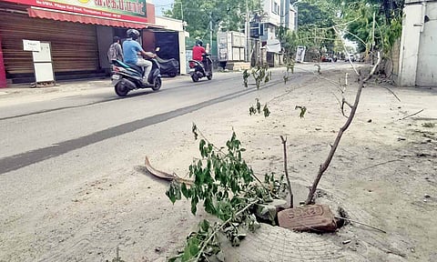 A damaged and almost open manhole cover at the SBI colony in Thoraipakkam