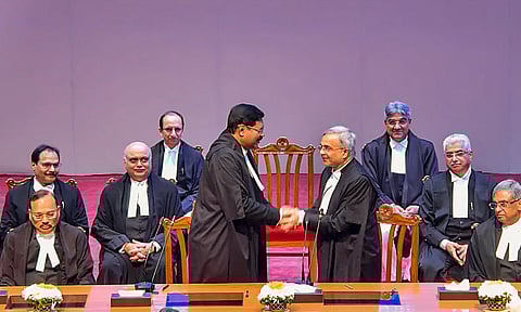 Chief Justice of India (CJI) B R Gavai after administering the oath of office to Justice N V Anjaria during his swearing-in ceremony as Supreme Court judge, in New Delhi (PTI)