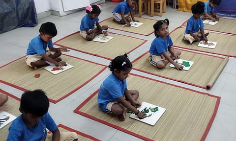 Kindergarten students engaging in activities at the Chennai Primary School in MMDA Colony 