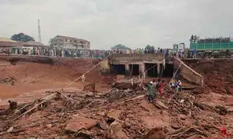 People search in flooded area following a downpour in Mokwa, Nigeria (AP)
