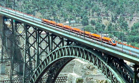 Reasi: Vande Bharat train, flagged off by Prime Minister Narendra Modi, crosses the Chenab rail bridge, in Reasi district of J&K, Friday (PTI)
