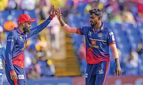 Pacer M Mohammed celebrates after taking a wicket