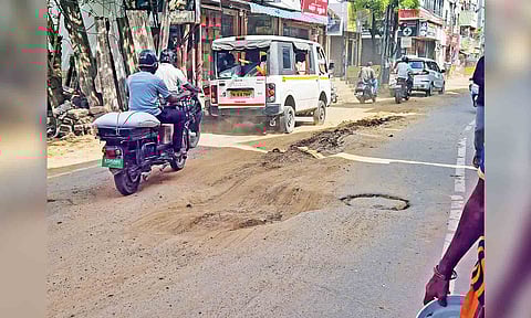 Pothole-ridden narrow stretch of Vada Agaram Road