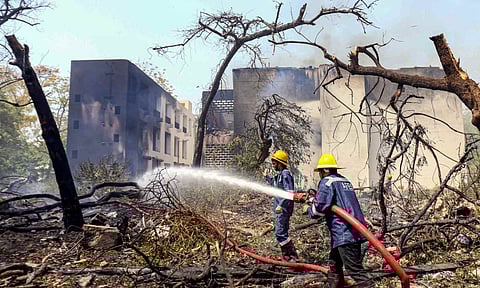 Firefighting team at the spot after a London-bound Air India plane crashed moments after taking off from the Ahmedabad airport (PTI) 