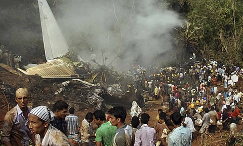 Rescuers work at the site of an Air India plane that crashed in Mangalore, in the southern Indian state of Karnataka, Saturday, May 22, 2010 (AP) 