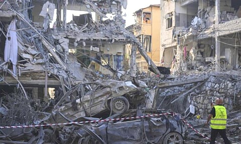 Israeli security forces inspect destroyed residential buildings that were hit by a missile fired from Iran, in Ramat Gan, near Tel Aviv, Israel, (AP)