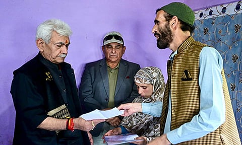 J&K LG Manoj Sinha hands job letter to his wife Gulnaz Akhter (Photo/X/@OfficeOfLGJandK) 