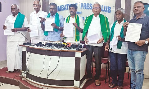 Farmers with a declaration document opposing the project 