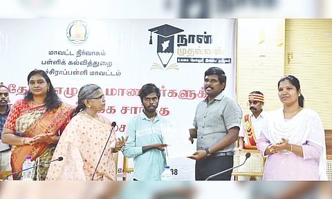 Collector Pradeep Kumar hands over college admission to a student