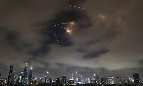 Israeli air defense system fires to intercept missiles during an Iranian attack over Tel Aviv (AP)
