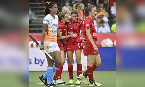 Belgium players celebrate after scoring against India