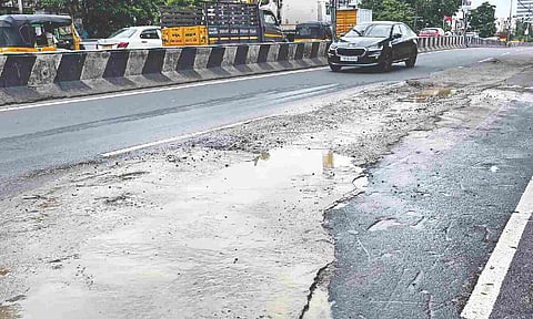 The damp and damaged part of the Velachery Bypass Road calls for attention