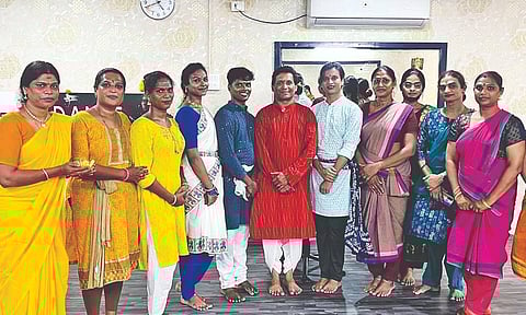 Shanmugasundaram (red kurta) with his students