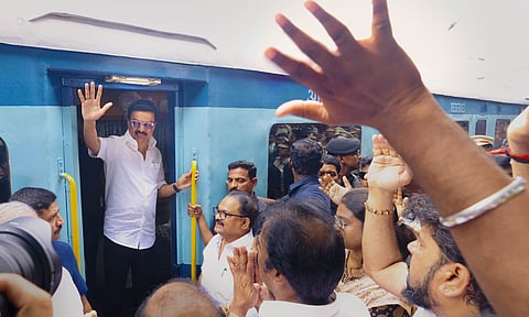Tamil Nadu Chief Minister MK Stalin waves to supporters from a train coach as he heads to Katpadi (X/@mkstalin) 
