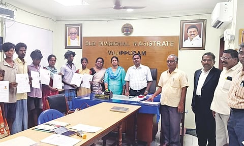 The freed bonded labourers with officials