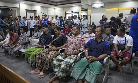  Survivors rescued after a ferry sank wait for a health examination in Gilimanuk on Bali island, Indonesia (Credit: AP Photo)