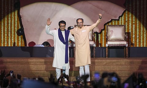 Maharashtra Navnirman Sena (MNS) chief Raj Thackeray, back, and Shiv Sena (UBT) chief Uddhav Thackeray during a joint victory rally, titled 'Awaj Marathicha', organised by the cousins, at Worli area, in Mumbai, Maharashtra, Saturday, July 5, 2025 (PTI) 