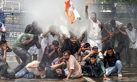 Police use water cannon to disperse Congress workers during a protest demanding the resignation of Kerala Health Minister Veena George over the death of a woman in a building collapse at Kottayam Medical College, in Thiruvananthapuram, Saturday, July 5, 2025 (PTI) 