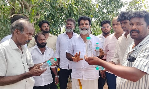 Locals in Ponneri stage protest after man finds dead lizard in packaged water bottle
