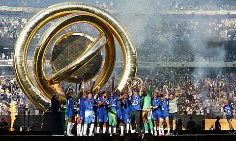 Chelsea players celebrate with the title 