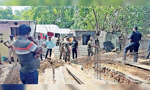 Army personal demolishing the partially built temple on Thursday