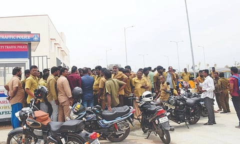 Two groups of auto drivers arguing for want of space at the IBT in Panjapur on Friday