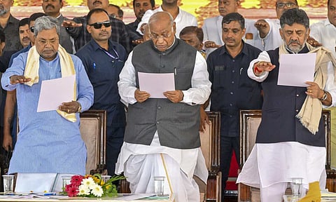 Karnataka Chief Minister Siddaramaiah, Congress President Mallikarjun Kharge and Deputy Chief Minister D.K. Shivakumar during the inauguration and foundation stone laying ceremony of various developmental projects, in Mysuru, Karnataka, Saturday, July 19, 2025 (PTI) 